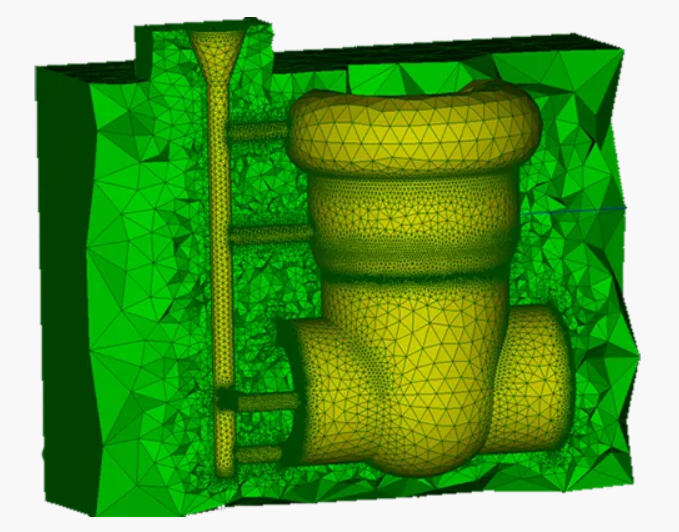 Computational model shows a three-dimensional finite-element mesh of interconnected cylindrical and rounded components enclosed within a larger meshed volume. Fine triangular elements cover the central vertical assembly and adjacent pipes, while coarser elements appear toward the outer domain, indicating varying mesh density across the simulated geometry.